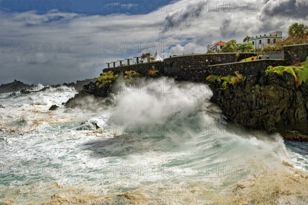 High waves on the rocks of Porto Moniz, surf on the Atlantic Ocean, storm, clouds, Porto Moniz, Madeira, Portugal, Europe