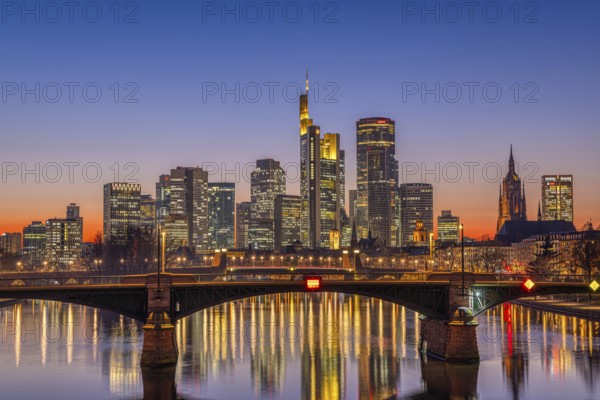 The lights of Frankfurt's banking skyline glow in the evening after sunset, Frankfurt am Main, Hesse, Germany, Europe