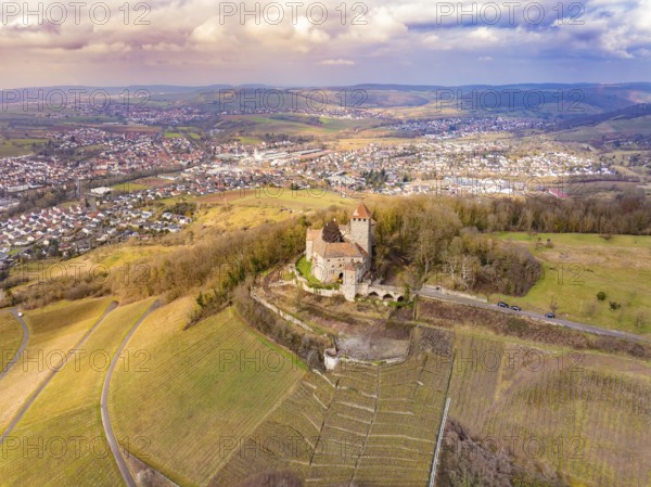 An impressive view of the castle and the surrounding fields, surrounded by a village and hills, Lichtenberg Castle, Oberstenfeld, Germany, Europe