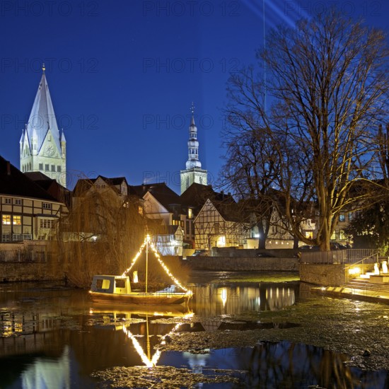 Large pond, St. Patrokli Cathedral and St. Peter's Church in the evening during winter sunshine, Old Town, Soest, North Rhine-Westphalia, Germany, Europe
