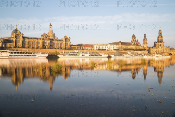 Silhouette of the Old Town with reflection in the Elbe in the morning, steamboats on the Terrassenufer, Brühl's Terrace, Academy of Fine Arts, dome of the Church of Our Lady, Sekundogenitur, Ständehaus, Georgentor, Hausmannsturm, Hofkirche and Augustusbrücke, Dresden, Saxony, Germany, Europe