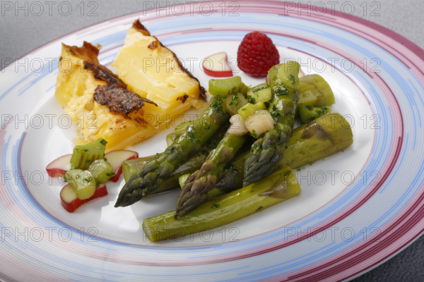 South German cuisine, green asparagus with rhubarb vinaigrette and potato gratin, healthy, vegetables, plated, vegetarian, traditional cuisine reinterpreted, food photography, studio, Germany, Europe