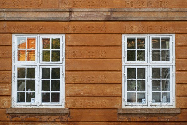 Windows with white frames, rust-red house, Frederiksholms Canal, Copenhagen, Denmark, Europe
