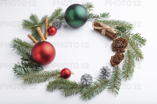 Christmas or New Year wreath composition. Decorations, balls, cones, fir and spruce branches, on white background. Side view, copy space