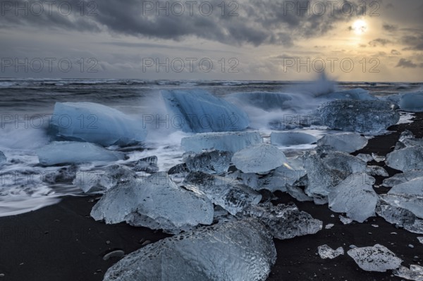 Ice floes on the beach, waves, sea, clouds, sunlight, winter, Diamond Beach, Breidamerkursandur, Jökulsarlon, Iceland, Europe