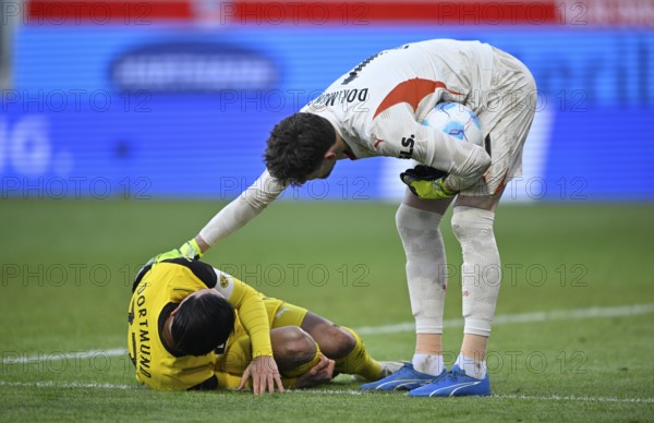 Goalkeeper Kevin Mueller 1. FC Heidenheim 1846 FCH (01) takes care of Omar Haktap Traore 1. FC Heidenheim 1846 FCH (23) injured Injury Voith-Arena, Heidenheim, Baden-Württemberg, Germany, Europe