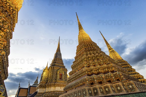 Wat Pho temple at sunset. Bangkok's oldest Buddhist monastery near the Grand Palace. Four chedis are among the most precious in Bangkok. Bangkok, Thailand, Asia