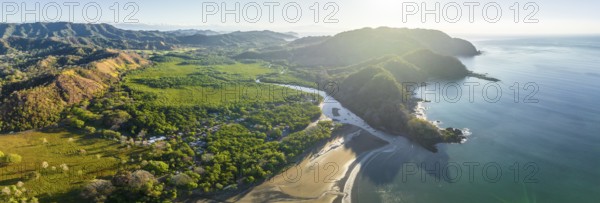 Aerial view, panorama of a coastal region with mountains, beach and forest in natural light, Pochote, Puntarenas, Costa Rica, Central America