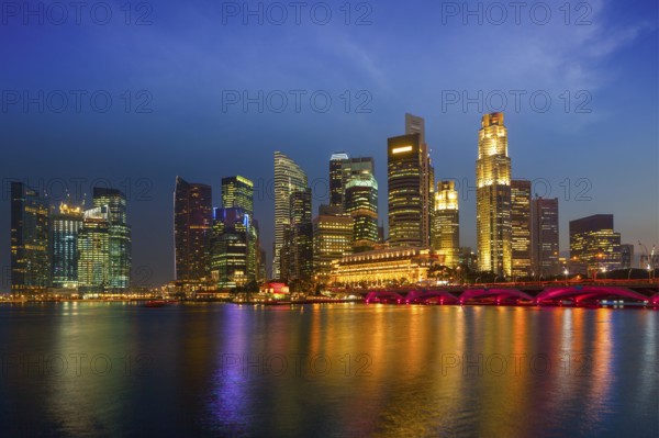 Singapore skyline and Marina Bay in evening