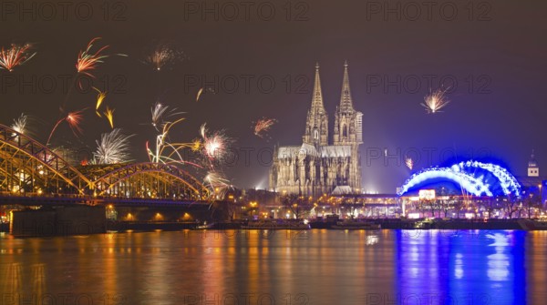 New Year's Eve fireworks, Hohenzollernbruecke with cathedral and Musical Dome, Rheinufer, Cologne, Rhineland, North Rhine-Westphalia, Germany, Europe