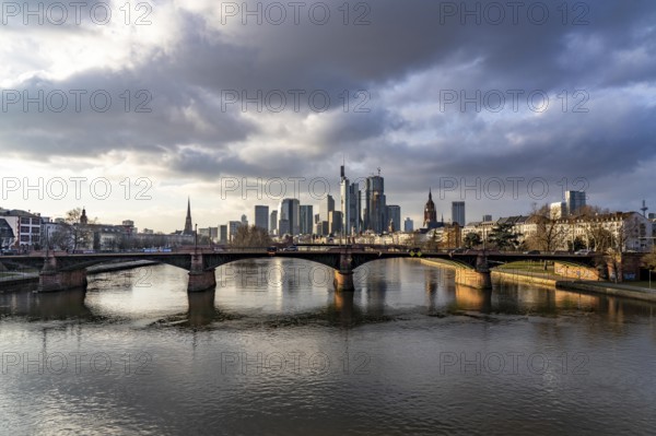 Skyline of the city centre of Frankfurt am Main, river Main, Ignatz-Bubis-Bridge, dusk, Hesse, Germany, Europe