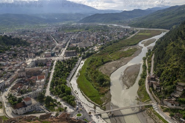 View looking over city centre of Berat in valley of River Osum with mountains beyond, Berat, Albania, Europe