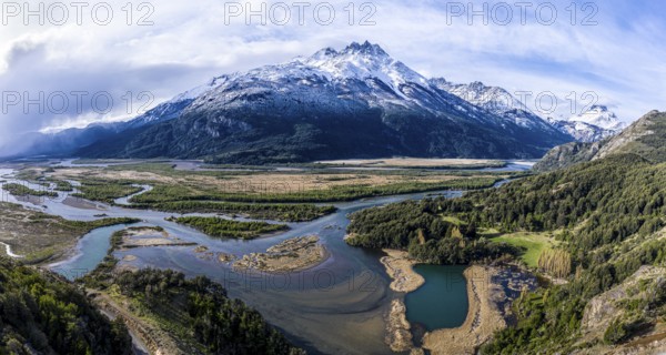 Valley of river Rio Ibanez south of village Villa Cerro Castillo, many branches of the river find their way in the large floodplain, aerial view, snow-capped mountains in early spring, Patagonia, Chile, South America