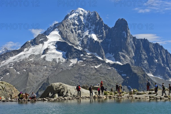 At the Lac Blanc mountain lake, with the Aiguille Verte and Aiguille du Dru peaks behind, Chamonix, Savoie, France, Europe