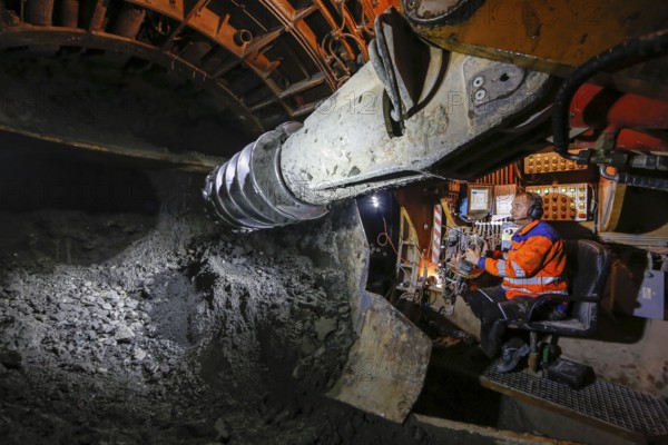 Theme photo Emscher conversion, the Emscher system will be wastewater-free in 2021 - new construction of a sewer on the Boye, the second largest tributary of the Emscher, a machine operator in the tunnelling machine digs the tunnel for the DN 3500 concrete wastewater pipes, the Boye is renaturalised and transformed into a near-natural body of water, was previously an open, above-ground wastewater sewer, mixed sewer with surface water and wastewater, the ecological conversion of the Emscher system consists of the construction of a central wastewater treatment system in the Ruhr area, the construction of sewers and the renaturalisation of the Emscher and its tributaries, archive photo from 13.11.2014, Bottrop, Ruhr area, North Rhine-Westphalia, Germany - -