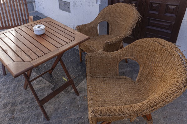 Table and chairs in the outdoor catering area, Vejer, Andalusia, Spain, Europe