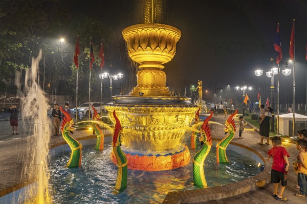 Illuminated fountain in Fountain Square Park in Luang Prabang, Laos, Asia