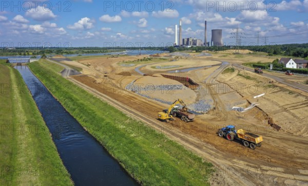 Dinslaken, North Rhine-Westphalia, Germany, Emscher estuary into the Rhine. On the right, the construction site of the new Emscher estuary in front of the decommissioned STEAG coal-fired power plant in Voerde. The mouth of the Emscher into the Rhine is being moved almost 500 metres north from Dinslaken to Voerde. Fish will then be able to swim barrier-free up the new Emscher from the Rhine through a newly created floodplain area. Following the construction of a parallel sewer, the Emscher has been completely free of sewage since January 2022. The river was previously an open, above-ground combined sewer with rainwater and wastewater, Europe
