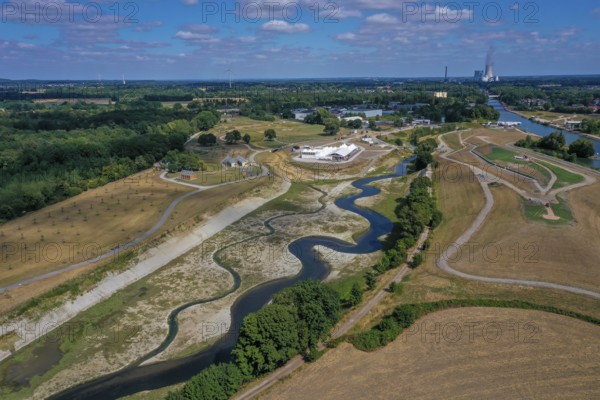 Recklinghausen, Castrop-Rauxel, North Rhine-Westphalia, Germany, EMSCHERLAND construction project, a 37-hectare water and nature discovery park at the water crossroads of the Rhine-Herne Canal (right) and the renaturalised Emscher (centre) on the city limits of Recklinghausen and Castrop-Rauxel. The ecological focus at the confluence of Suderwicher Bach (left) and Emscher (centre) will also be a future garden for the International Garden Exhibition 2027. Before the renaturation, the Emscher river system was an open, above-ground wastewater canal, combined sewer with surface water and wastewater. The Uniper power plant Datteln 4 in the background, Europe