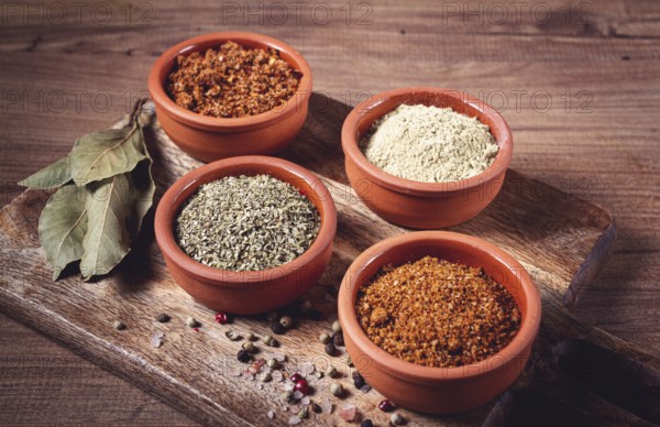 Georgian spices, in ceramic bowls, assortment, set of spices, utsho, adjika, Svan salt, ground coriander, top view, no people