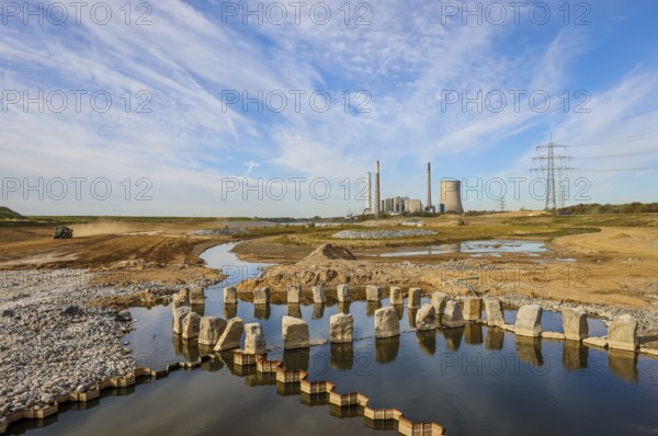 Dinslaken, Voerde, North Rhine-Westphalia, Germany, Emscher estuary into the Rhine. Construction site of the new Emscher estuary in front of the decommissioned STEAG coal-fired power station in Voerde. The mouth of the Emscher into the Rhine is being moved almost 500 metres north from Dinslaken to Voerde. Fish will then be able to swim barrier-free up the new Emscher from the Rhine through a newly created floodplain area. Following the construction of a parallel sewer, the Emscher has been completely free of sewage since January 2022. The river was previously an open, above-ground combined sewer with rainwater and wastewater, Europe