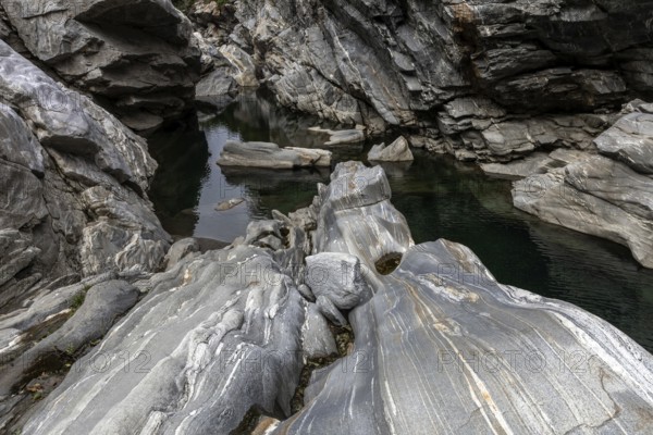 Rocks, granite rock formations in the Maggia River near Ponte Brolla, in the Maggia Valley, Valle Maggia, Canton Ticino, Switzerland, Europe