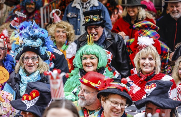 Colourfully costumed carnivalists celebrate carnival in Cologne, on Weiberfastnacht the street carnival is traditionally opened on the Alter Markt, which then reaches its climax on Rosenmontag, Cologne, Rhineland, North Rhine-Westphalia, Germany, Europe