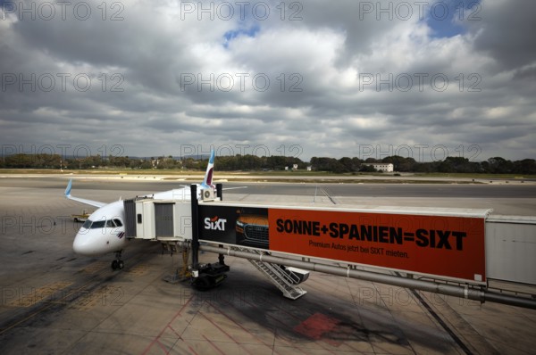 Aircraft Airbus A320 of the airline Eurowings GmbH at passenger boarding bridge or finger, advertising SIXT, tarmac, Aeropuerto de Son San Juan, Airport Palma de Majorca, PMI, Majorca, Balearic Islands, Balearic Islands, Spain, Europe