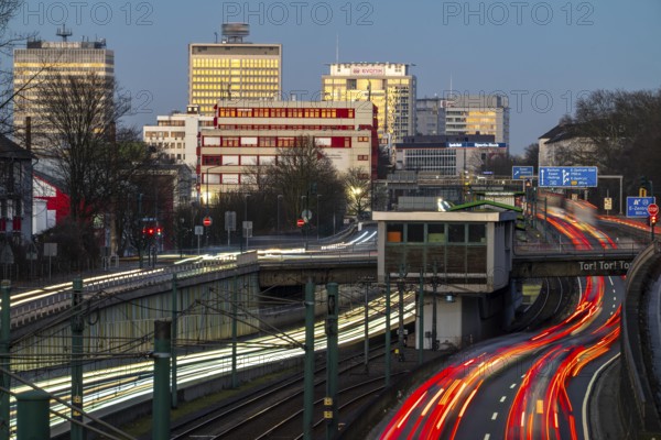 Motorway A40, Ruhr expressway, heavy traffic jam, rush hour, city passage in Essen, skyline of the city centre, underground line between the lanes, Hobeisenbrücke stop, North Rhine-Westphalia, Germany, Europe