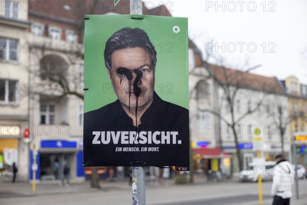 Berlin, Germany - 18 January 2025: A damaged election poster for the 2025 federal election of the political party The Greens with their candidate for chancellor Robert Habeck