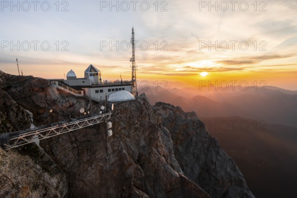 Mountain station of the Tyrolean Zugspitze railway at the summit of the Zugspitze, at sunset, Wetterstein Mountains, Northern Limestone Alps, Bavaria, Germany, Europe