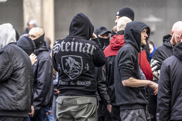 The neo-Nazi group Jung und Stark, JS, demonstrates in the city centre of Essen, demanding the remigration of foreigners, chanting Deutschland den Deutschen Ausländer raus, approx. 150 ultra right-wingers, dressed in black and wearing typical scene clothing, several groups demonstrate against the Nazi march, Essen, North Rhine-Westphalia, Germany, Europe