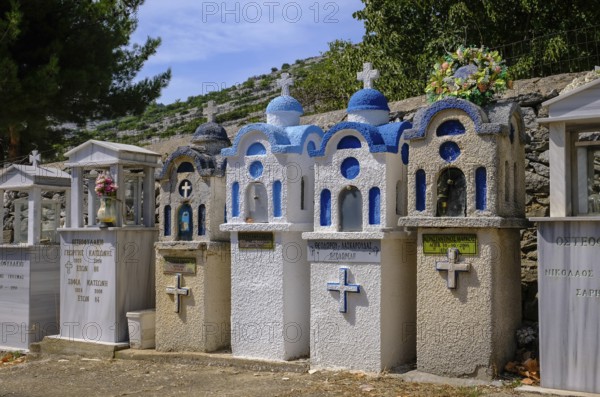 Theologos, Thassos, Greece - Greek Orthodox cemetery with traditional small prayer chapels in the mountain village of Theologos on the island of Thassos. The mountain village of Theologos is a popular excursion destination for holidaymakers. Thassos belongs to Eastern Macedonia and Thrace, also East Macedonia and Thrace