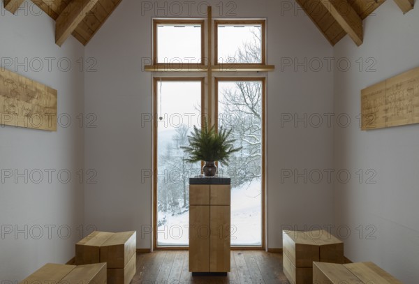 Interior of the chapel on the Glockenwanderweg trail with simple altar and small wooden benches, Oberlochmühle, Deutschneudorf, Erzgebirge, Saxony, Germany, Europe