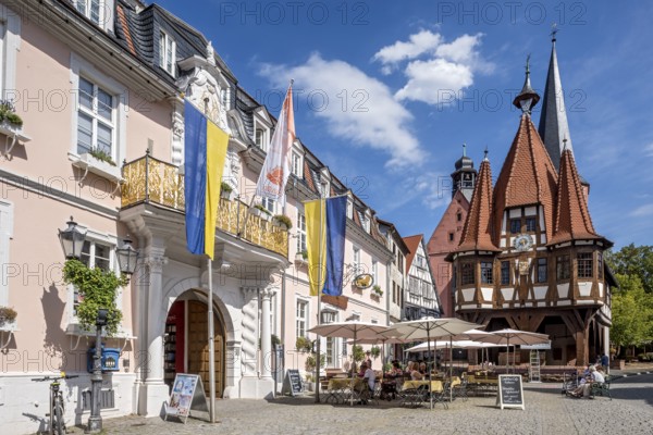 Baroque Löwenhof, Zum goldenen Löwen inn and Thurn und Taxis post office, post office, old town hall, late medieval half-timbered building, Gothic, cultural monument, bell tower of the town church, street café, pedestrian zone, market square, historic old town, Michelstadt, Odenwald, Hesse, Germany, Europe