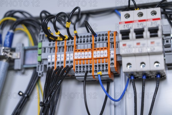 Close-up of wired circuit-breakers, showing technical accuracy and functional arrangement of components, switch cabinet construction, PV system construction, major customers, Enzkreis, Germany, Europe