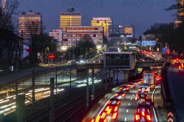 Motorway A40, Ruhr expressway, heavy traffic jam, rush hour, city passage in Essen, skyline of the city centre, underground line between the lanes, Hobeisenbrücke stop, North Rhine-Westphalia, Germany, Europe