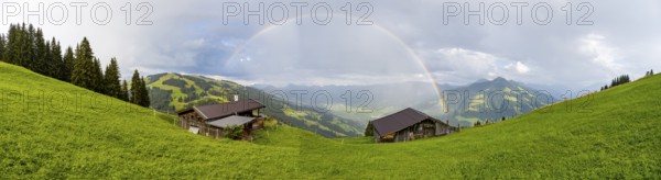 Alpine huts, view over the Brixen Valley with rainbow, Hochbrixen, Brixen im Thale, Kitzbühel Alps, Tyrol, Austria, Europe