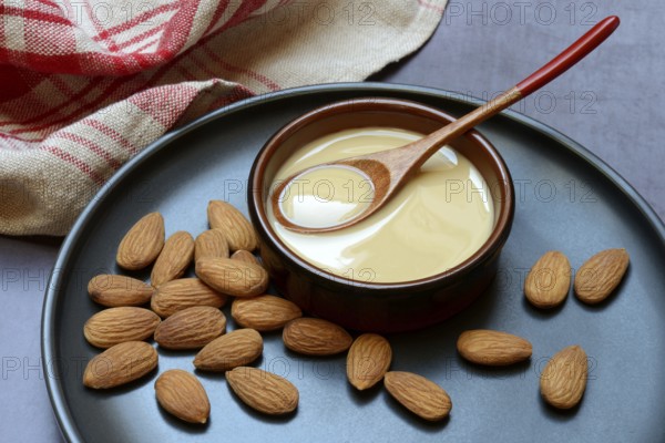White almond cream in small bowls, almond butter