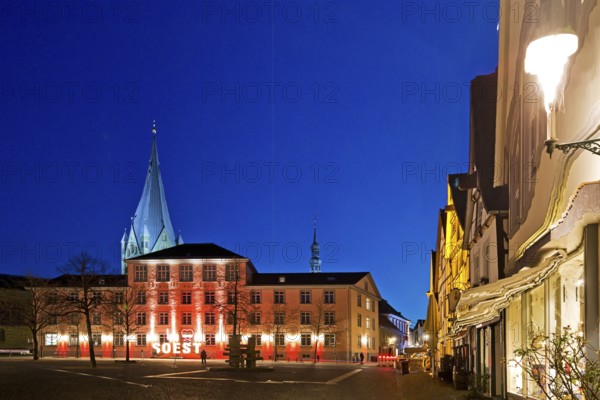 Illuminated town hall with St Patrokli Cathedral in the evening at the Winter Radiance Festival of Lights in Soest, North Rhine-Westphalia, Germany, Europe