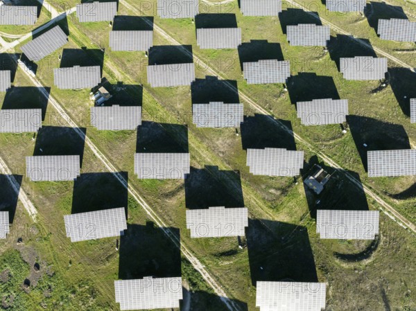 Rows of solar panels at a photovoltaic plant near town of Espejo. Aerial view. Drone shot. Córdoba province, Andalucía, Spain, Europe