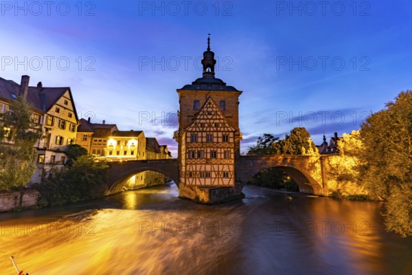 The Old Town Hall in the river Regnitz at dusk, Old Town of Bamberg, Upper Franconia, Bavaria, Germany, Europe