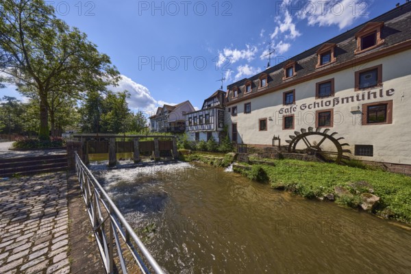 Castle mill, river Mümling, watermill, half-timbered house, historical building, metal railing, weir, trees, cobblestone pavement, backlight, Lustgartenstraße, Erbach, Odenwald, Odenwaldkreis, Hesse, Germany, Europe