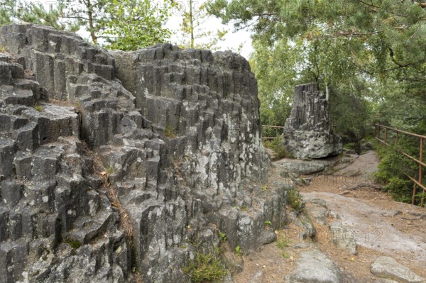Large and small organ rock formation on the nature trail through the millstone quarries near Jonsdorf, Zittau Mountains, Saxony, Germany, Europe