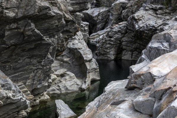 Rocks, granite rock formations in the Maggia River near Ponte Brolla, in the Maggia Valley, Valle Maggia, Canton Ticino, Switzerland, Europe