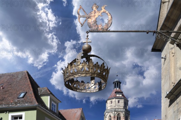 Nose sign of the Hotel Restaurant Krone, 15th century, Rosenstraße 10, behind the tower of the parish church of St Andrew, Weißenburg, Middle Franconia, Bavaria, Germany, Europe