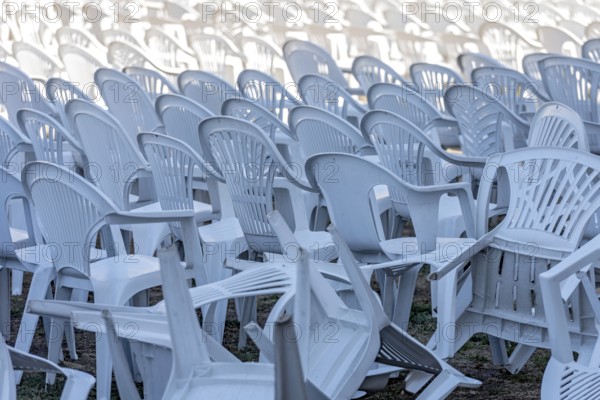 Seating for outdoor event, rows of chairs, overturned garden chairs made of plastic, plastic, monobloc design, disturbed order, clutter, Butzbach, Wetterau, Hesse, Germany, Europe