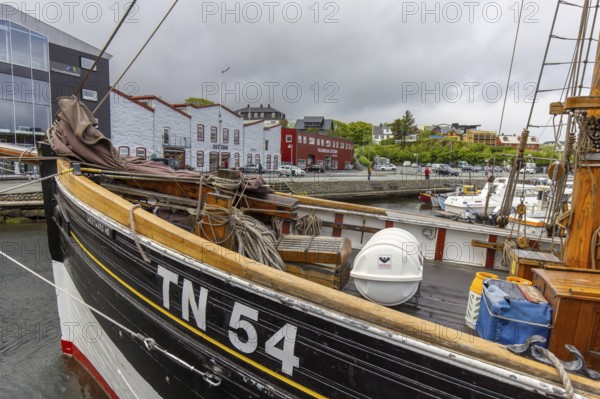 Old wooden fishing boat in harbour of Tórshavn, Thorshavn port on the island Streymoy, Faroe Islands, Europe