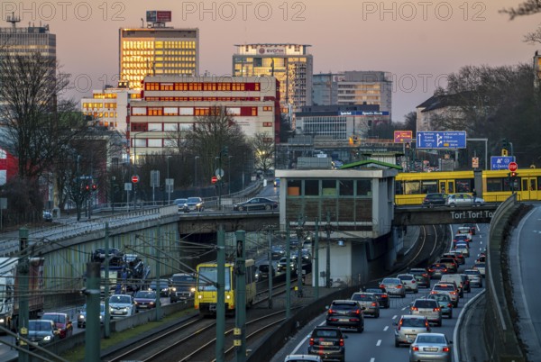 Motorway A40, Ruhr expressway, heavy traffic jam, rush hour, city passage in Essen, skyline of the city centre, underground line between the lanes, tram, Hobeisenbrücke stop, North Rhine-Westphalia, Germany, Europe
