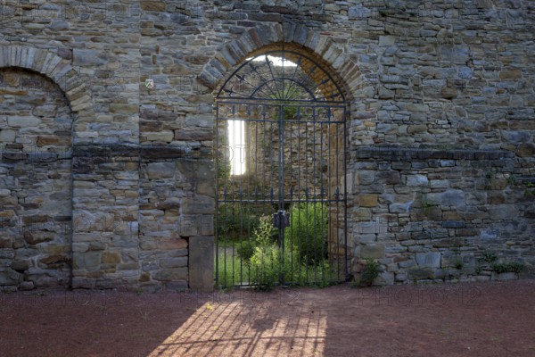 Wetter an der Ruhr, North Rhine-Westphalia, Germany - Wetter Castle in the historic old town centre of Wetter an der Ruhr. Entrance gate backlit
